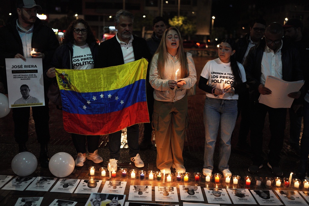 Venezuelans rally for the release of what they consider to be political prisoners and honor opposition leader Maria Corina Machado who was awarded the 2025 Nobel Peace Prize, in Bogota, Colombia, Saturday, Oct. 11, 2025. (AP Photo/Ivan Valencia)