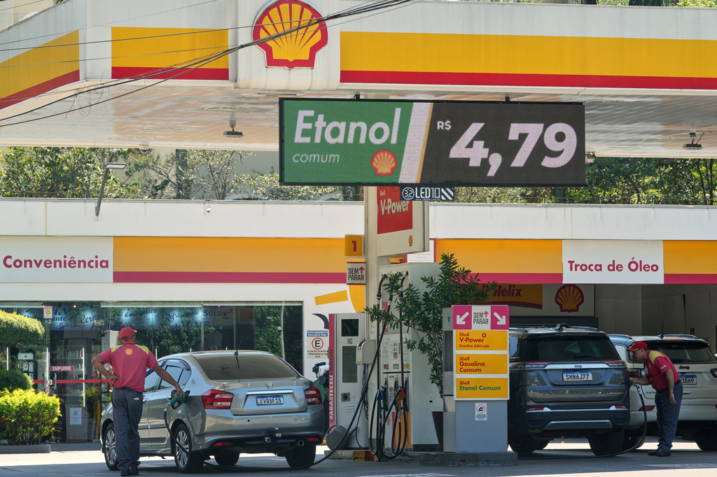 Cars fuel up with ethanol at a gas station in Sao Paulo, Friday, March 27, 2026. (AP Photo/Andre Penner)