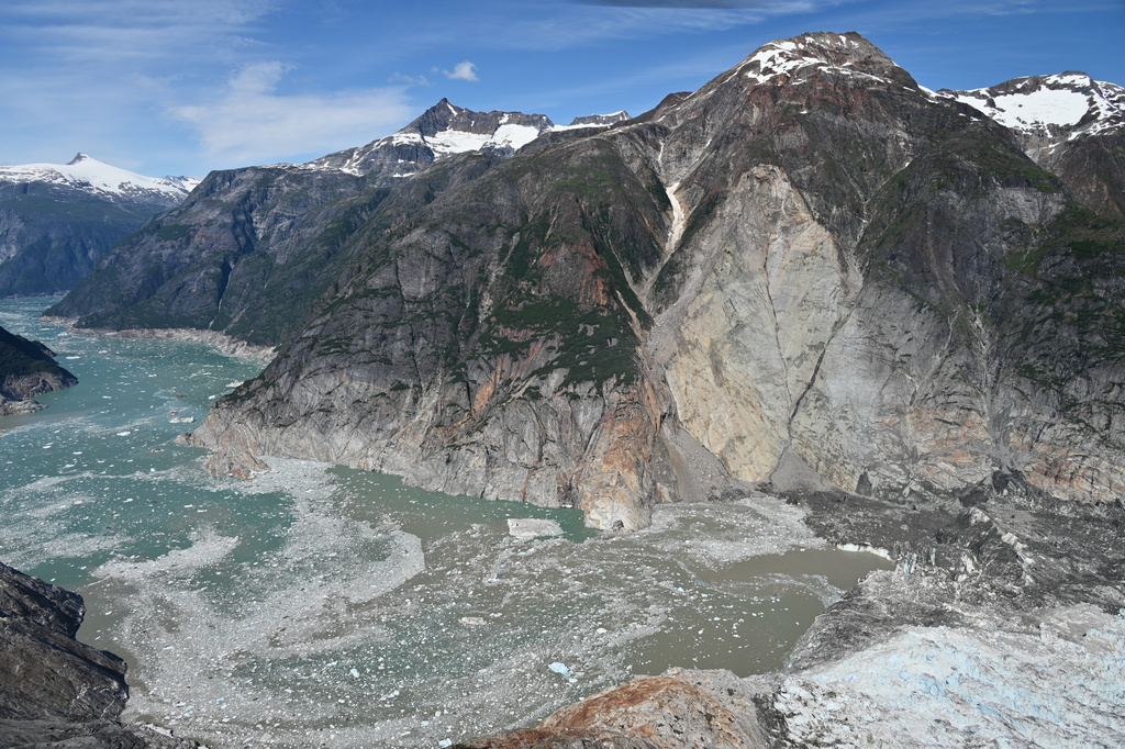 This photo provided by the U.S. Geological Survey shows the slope where a landslide occurred days earlier near the terminus of the South Sawyer Glacier, lower right, in Tracy Arm fjord about 80 miles southeast of Juneau, Alaska, on Aug. 13, 2025. (John Lyons/U.S. Geological Survey via AP)