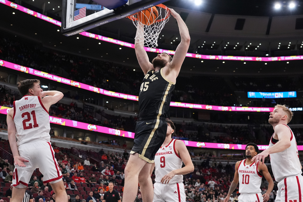 Purdue center Oscar Cluff (45) dunks against Nebraska during the first half of an NCAA college basketball game in the quarterfinals of the Big 10 Conference tournament, Friday, March 13, 2026, in Chicago. (AP Photo/Nam Y. Huh)
