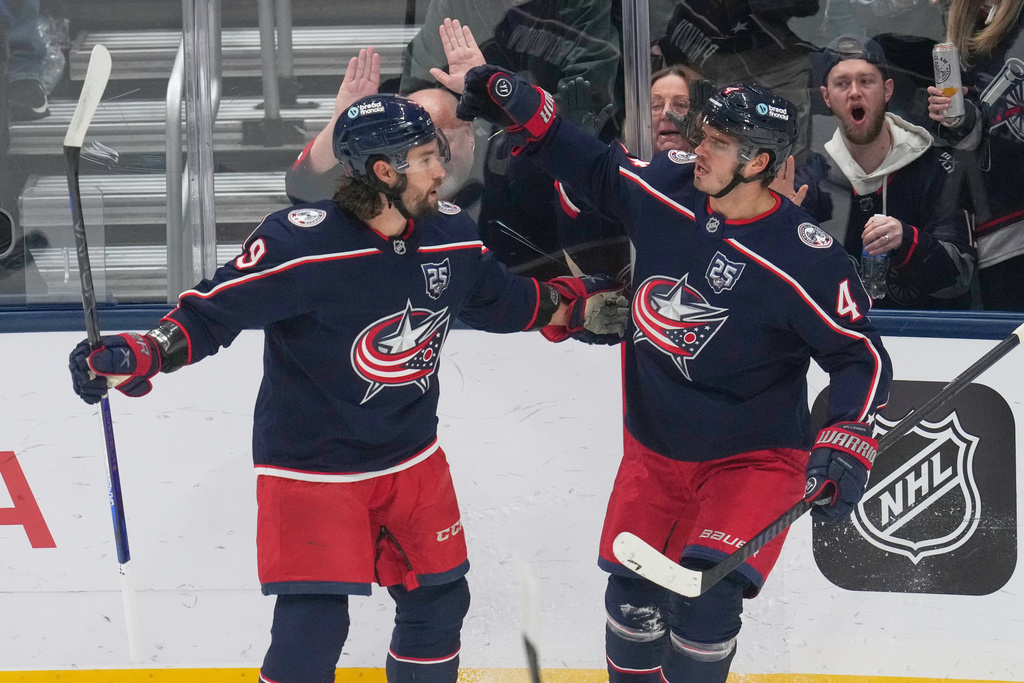 Columbus Blue Jackets center Cole Sillinger (4) celebrates his goal with defenseman Ivan Provorov (9) in the first period of an NHL hockey game against the Toronto Maple Leafs in Columbus, Wednesday, Oct. 29, 2025. (AP Photo/Sue Ogrocki)