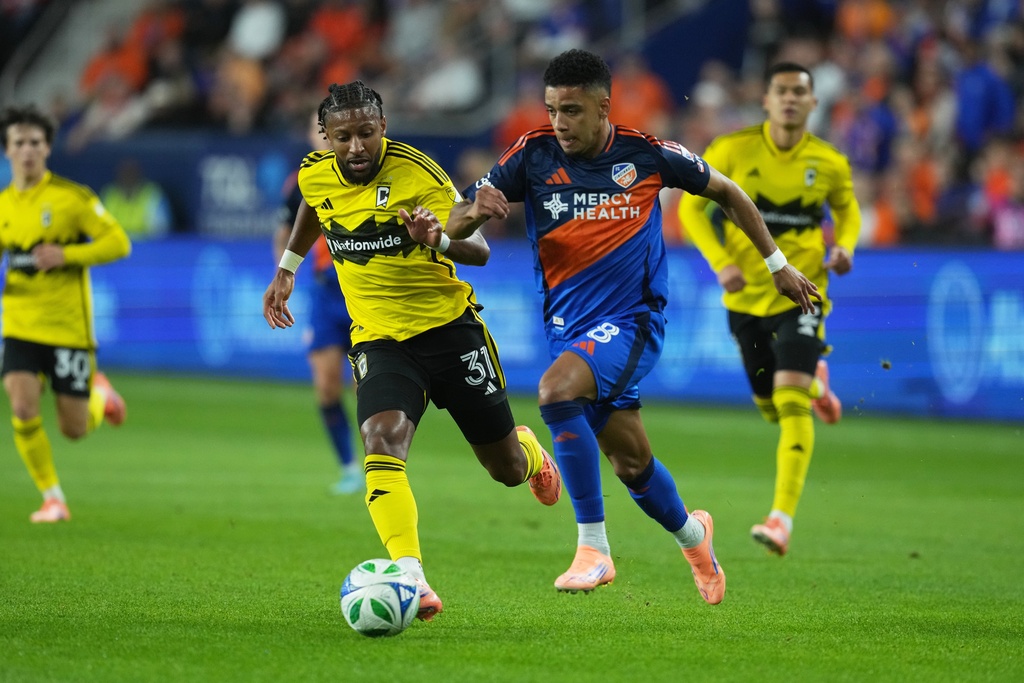 FC Cincinnati forward Brenner (8) controls the ball against Columbus Crew defender Steven Moreira (31) during the first half of Game 3 in the first round of MLS soccer's Eastern Conference playoffs, Saturday, Nov. 8, 2025, in Cincinnati.(AP Photo/Darron Cummings)