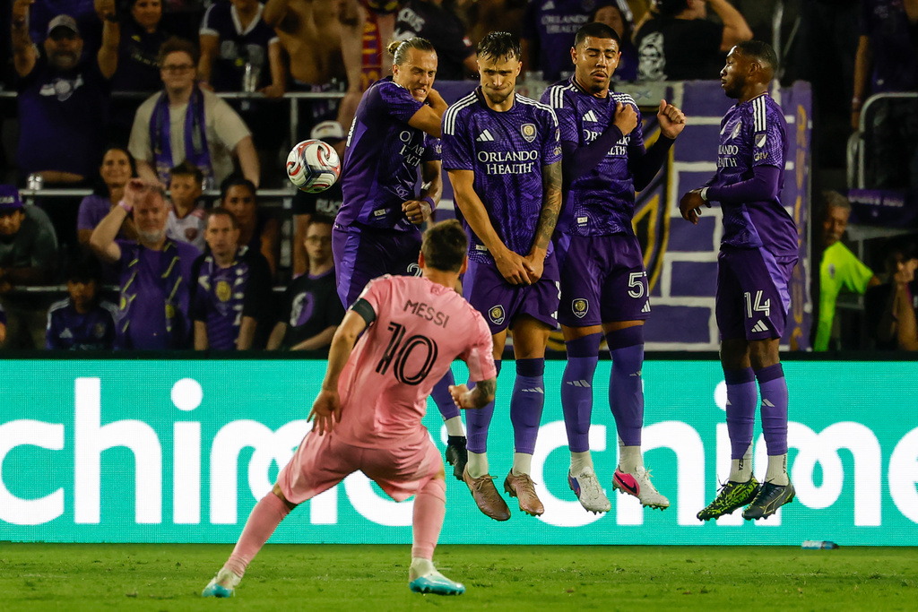 Inter Miami CF forward Lionel Messi (10) takes his penalty kick around Orlando City SC blockers during the second half of an MLS soccer match, Sunday, March 1, 2026, in Orlando, Fla. (AP Photo/Kevin Kolczynski)