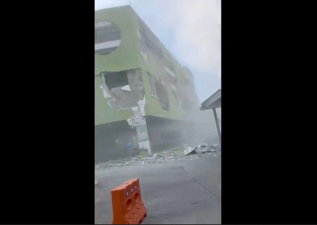 This image from a video shows dust and debris outside a building after a powerful earthquake in General Santos city on the island of Mindanao, Philippines Monday, June 8, 2026. (Ernesto Torres Jr via AP)