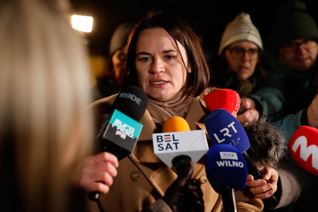 Belarusian opposition leader Sviatlana Tsikhanouskaya speaks to journalists as she waits to meet released Belarusian prisoners at the U.S. Embassy in Vilnius, Lithuania, on Saturday, Dec. 13, 2025. (AP Photo/Mindaugas Kulbis)
