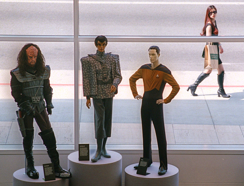 FILE - A pedestrian passes by life-size models of characters "Klingon," left, "Romulan," center, and "Data," from the "Star Trek" television show on opening day of the Museum of Television & Radio in Beverly Hills, Calif., on March 18, 1996. (AP Photo/Chris Pizzello, File)
