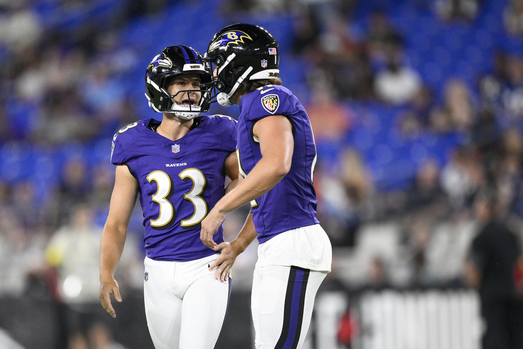 Baltimore Ravens place kicker Tyler Loop (33) talks with holder Jordan Stout after kicking a field goal against the Indianapolis Colts during the second half of an NFL preseason football game Thursday, Aug. 7, 2025, in Baltimore. (AP Photo/Nick Wass)