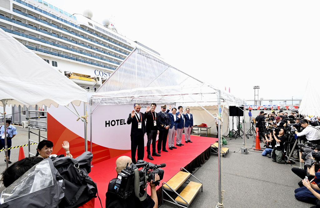 The ceremony for the Italian cruise ship, the Costa Serena, that will house up to 5,000 officials and athletes for the Asian Games, seen at background, is held upon the arrival at a port in Nagoya, central Japan, Tuesday, Sept. 15, 2026. (Kazushi Kurihara/Kyodo News via AP)