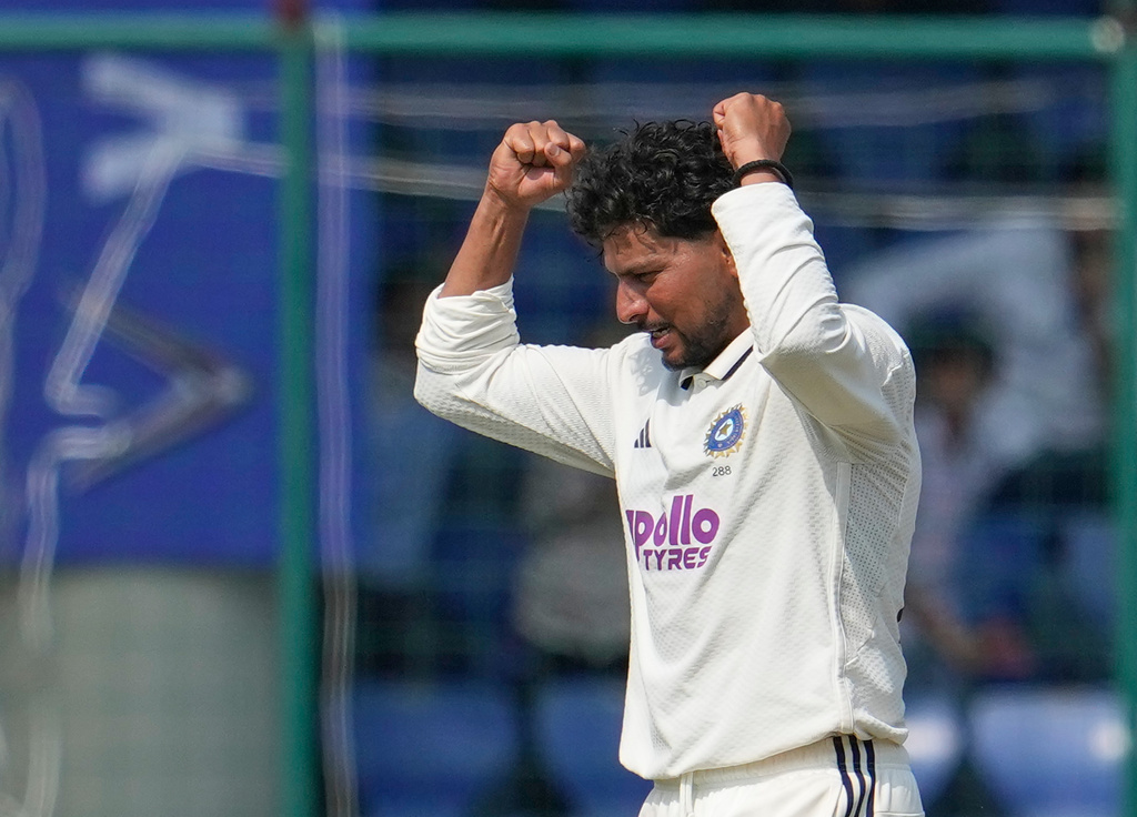 India's Kuldeep Yadav celebrates the dismissal of West Indies' Khary Pierre on the fourth day of the second cricket test match between India and West Indies at the Arun Jaitley Stadium in New Delhi, India, Monday, Oct.13, 2025. (AP Photo/Manish Swarup)