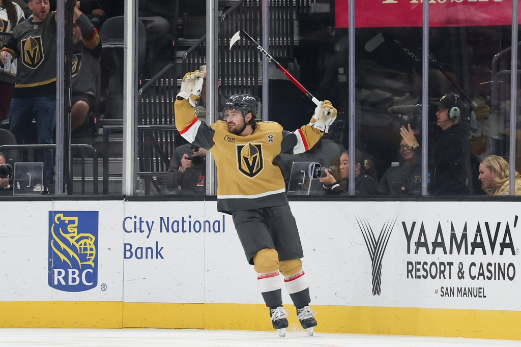 Vegas Golden Knights defenseman Rasmus Andersson celebrates after scoring against the Pittsburgh Penguins during the first period of an NHL hockey game Saturday, Oct. 17, 2026, in Las Vegas. (AP Photo/Ian Maule)