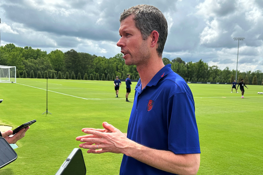 U.S. Soccer Federation CEO JT Batson answers questions from the media at the national training complex, Thursday, May 28, 2026, in Fayetteville, Ga., about the possibility of U.S. coach Mauricio Pochettino discussing taking a job with Italian club AC Milan. (AP Photo/Ronald Blum
