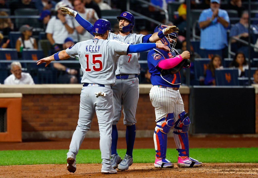 Chicago Cubs' Dansby Swanson (7) celebrates with Carson Kelly (15) after hitting a two-run home run against the New York Mets during the fourth inning of a baseball game, Tuesday, June 23, 2026, in New York. (AP Photo/Noah K. Murray)