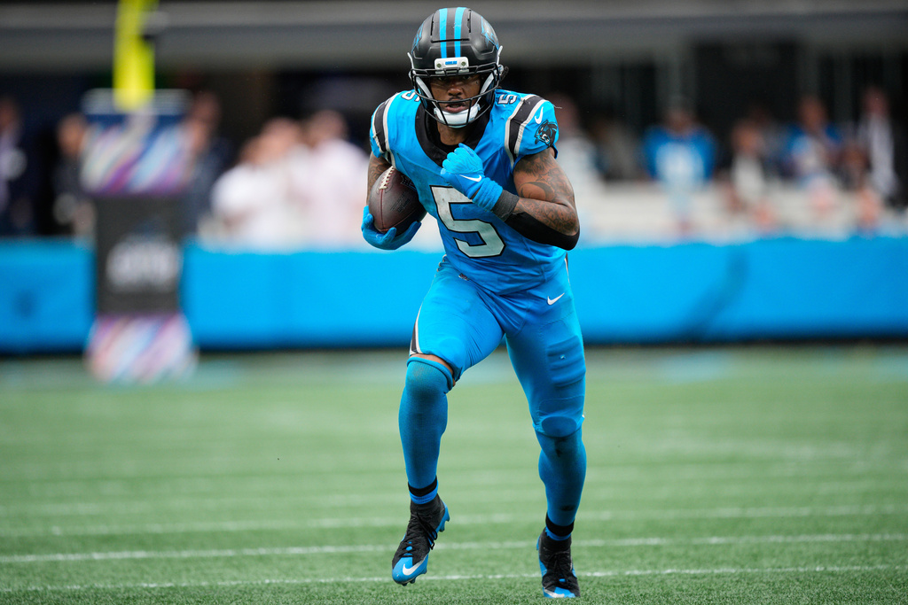 Carolina Panthers running back Rico Dowdle (5) runs the ball in the second half of an NFL football game against the Dallas Cowboys, Sunday, Oct. 12, 2025, in Charlotte, N.C. (AP Photo/Jacob Kupferman)