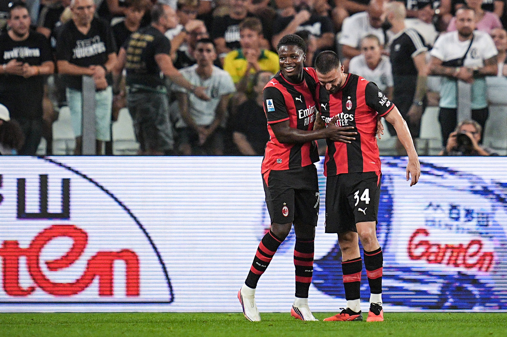 AC Milan's Alphadjo Cisse, left, celebrates scoring against Juventus during a Serie A soccer match in Turin, Italy, Sunday, Sept. 6, 2026. (Marco Alpozzi/LaPresse via AP)