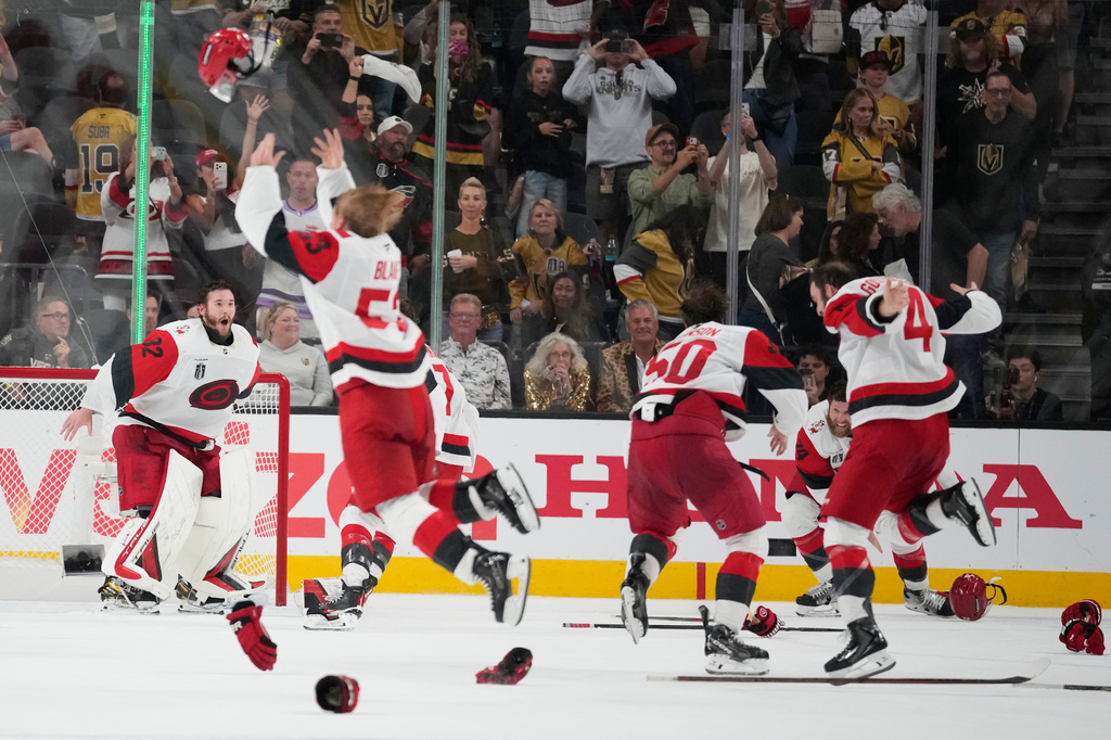 The Carolina Hurricanes celebrates after a win over the Vegas Golden Knights in Game 6 of the NHL hockey Stanley Cup Final series against the Vegas Golden Knights, Sunday, June 14, 2026, in Las Vegas. (AP Photo/John Locher)