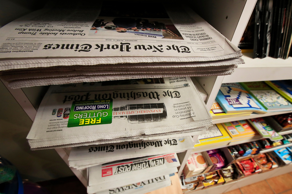 FILE - Newspapers are displayed magazine and newspaper stand, June 11, 2018, in Washington. (AP Photo/Manuel Balce Ceneta, FIle)