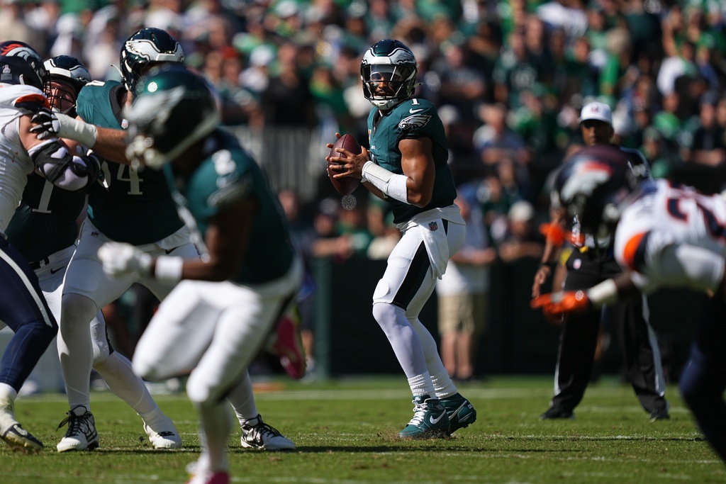 Philadelphia Eagles quarterback Jalen Hurts (1) looks to pass during the first half of an NFL football game against the Denver Broncos on Sunday, Oct. 5, 2025, in Philadelphia. (AP Photo/Matt Rourke)