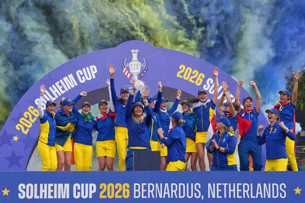 Anna Nordqvist, Europe team captain, holds the trophy aloft after her team won the Solheim Cup in Den Bosch, Netherlands, Sunday, Sept. 13, 2026. (AP Photo/Alastair Grant)
