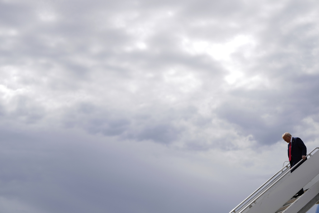 President Donald Trump disembarks Air Force One, Sunday, Sept. 21, 2025, upon arriving at Luke Air Force Base, Ariz., to attend a memorial for conservative activist Charlie Kirk. (AP Photo/Julia Demaree Nikhinson)