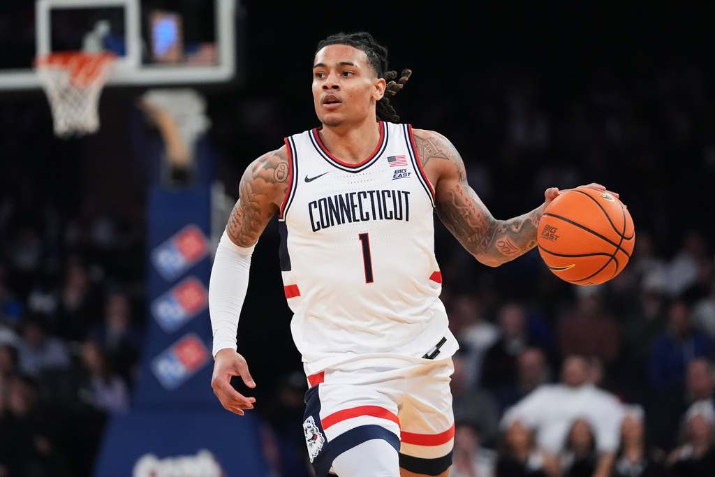 UConn's Solo Ball (1) looks to pass during first half of an NCAA college basketball game against Xavier in the quarterfinals of the Big East basketball tournament Thursday, March 12, 2026, in New York. (AP Photo/Frank Franklin II)