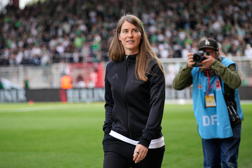 New head coach of German Bundesliga soccer club 1. FC Union Berlin Marie-Louise Eta looks on during the warm up prior to the German Bundesliga soccer match between FC Union Berlin and Wolfsburg in Berlin, Germany, Saturday, April 18, 2026. (AP Photo/Ebrahim Noroozi)