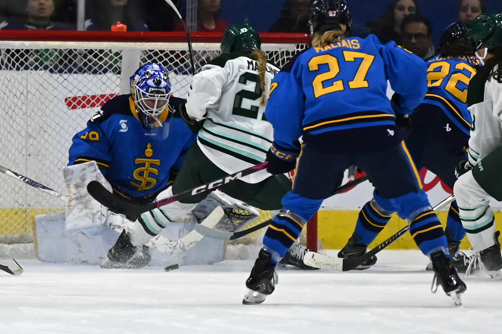 Toronto Sceptres goaltender Elaine Chuli (29) makes a stop against Boston Fleet's Shay Maloney (27) during second period of an PWHL hockey game against the Toronto Sceptres in Toronto on Friday, March 27, 2026. (Jon Blacker/The Canadian Press via AP)