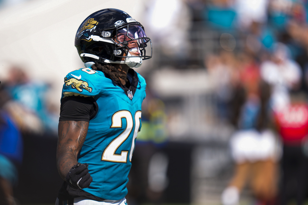 Jacksonville Jaguars safety Antonio Johnson reacts after making an interception on a pass by Houston Texans quarterback CJ. Stroud during the second half of an NFL football game Sunday, Sept. 21, 2025, in Jacksonville, Fla. (AP Photo/John Raoux)