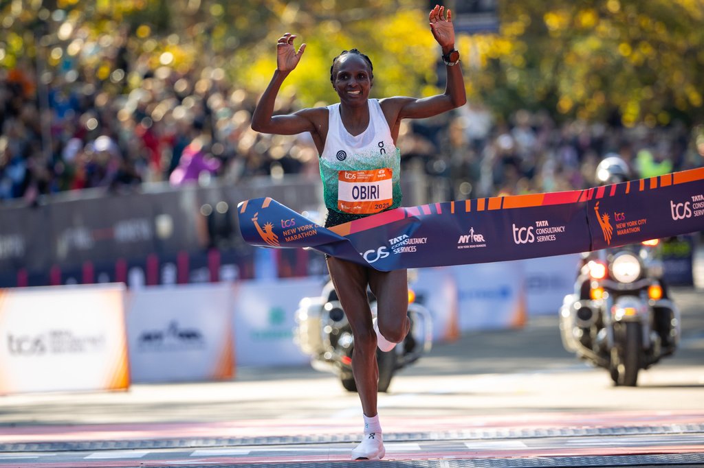FILE - Hellen Obiri crosses the finish line to win the women's elite division of the New York City Marathon, Sunday, Nov. 2, 2025, in New York. (AP Photo/Angelina Katsanis, File)