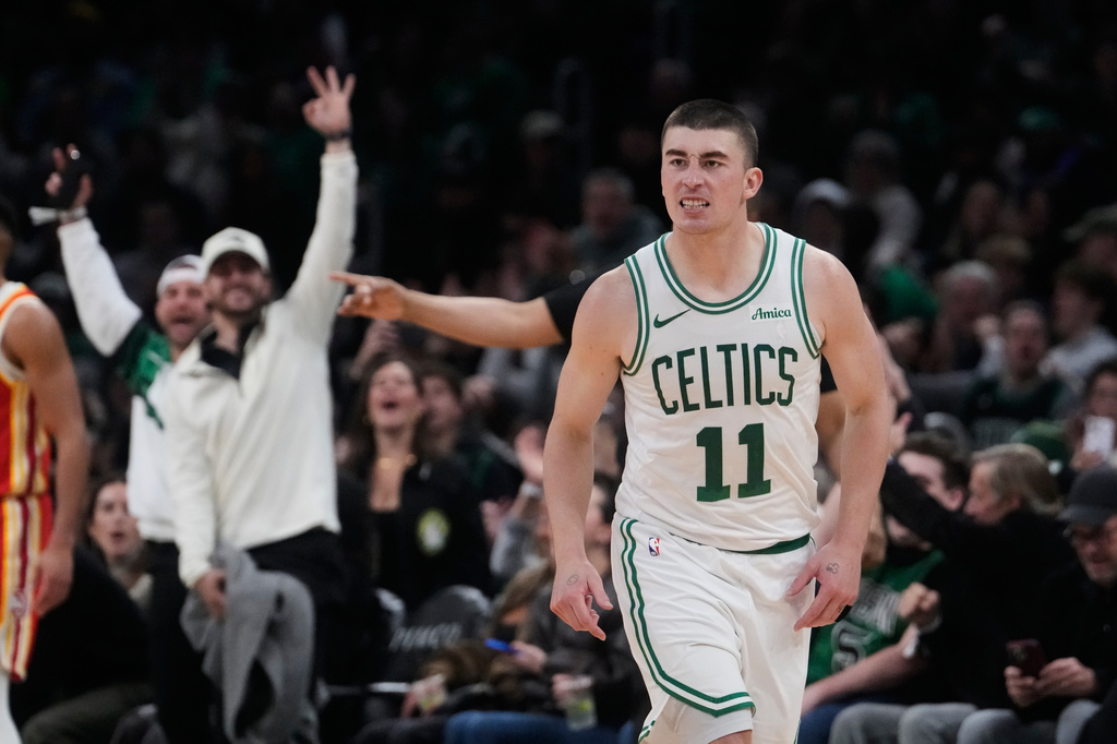 Boston Celtics guard Payton Pritchard (11) celebrates after hitting a 3-point basket against the Atlanta Hawks during the second half of an NBA basketball game, Friday, March 27, 2026, in Boston. (AP Photo/Charles Krupa)