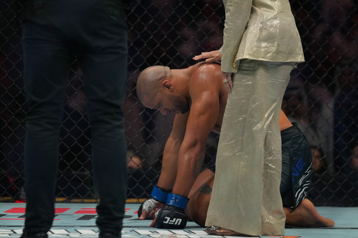 Ciryl Gane of France reacts after his fight with England's Tom Aspinall was called off during the heavyweight title bout at the UFC mixed martial arts Fight Night in Abu Dhabi, United Arab Emirates, Saturday, Oct. 25, 2025. (AP Photo/Altaf Qadri) Ciryl Gane of France reacts after his fight with England's Tom Aspinall was called off during the heavyweight title bout at the UFC mixed martial arts Fight Night in Abu Dhabi, United Arab Emirates, Saturday, Oct. 25, 2025. (AP Photo/Altaf Qadri)