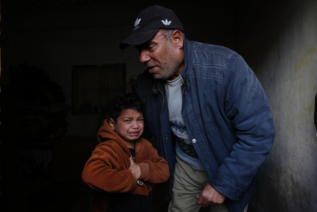 Yazid Al-Zayan, 9, mourns during the funeral of his father Khaled Al-Zayan, a Palestinian policeman, who was killed in an Israeli military strike, in Khan Younis, southern Gaza Strip, Friday, Feb. 27, 2026. (AP Photo/Abdel Kareem Hana)