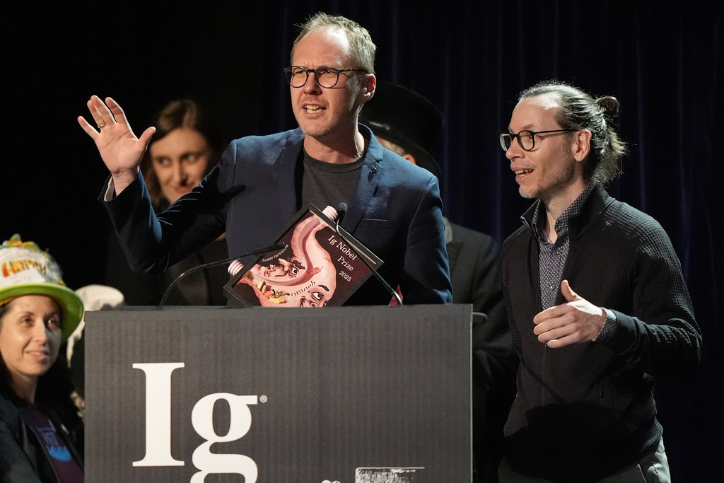 The Ig Nobel Prize for psychology is accepted by Marcin Zajenkowski, left, and Gilles Gignac, for investigating what happens when you tell narcissists — or anyone else — that they are intelligent, Thursday, Sept. 18, 2025, in Boston. (AP Photo/Robert F. Bukaty)