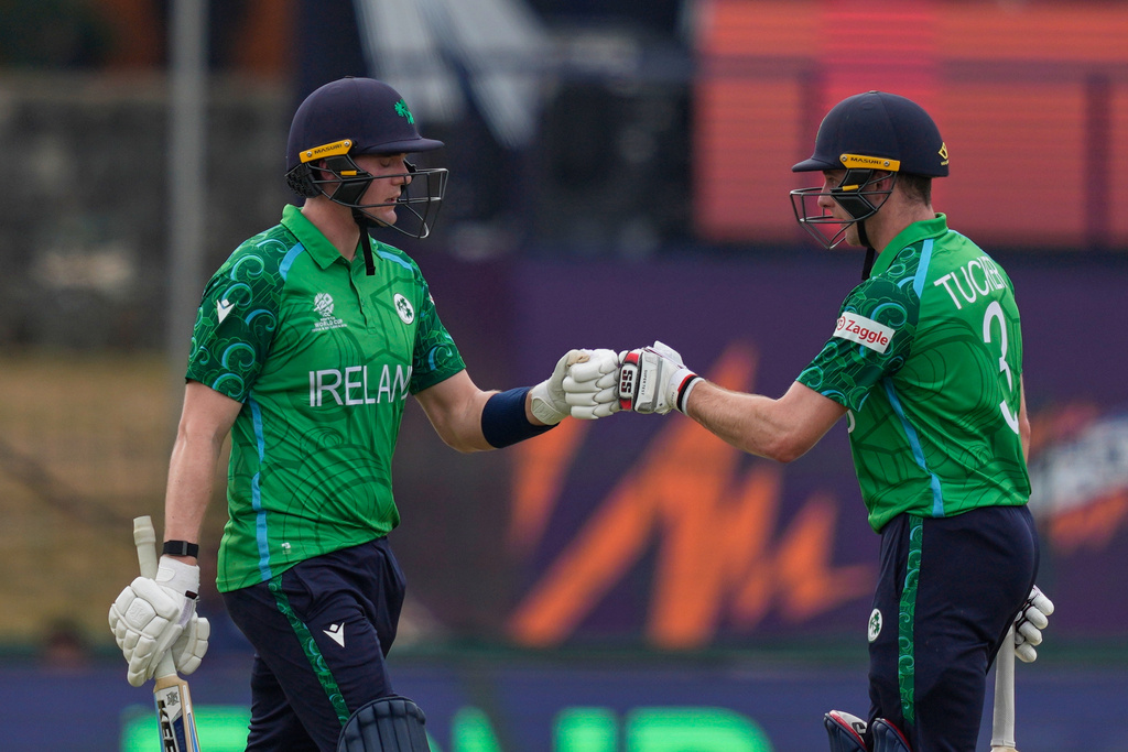 Ireland's Gareth Delany, left, Lorcan Tucker, right, encourage each other as they bat during the T20 World Cup cricket match between Ireland and Oman in Colombo, Sri Lanka, Saturday, Feb. 14, 2026. (AP Photo/Eranga Jayawardena)