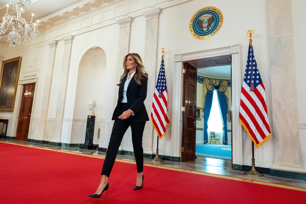 First lady Melania Trump arrives to speak in the Grand Foyer of the White House, Friday, Oct. 10, 2025, in Washington. (AP Photo/Alex Brandon, Pool)