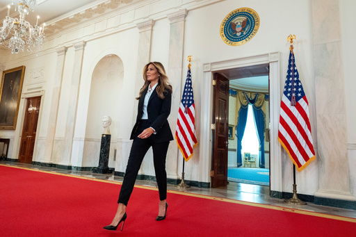 First lady Melania Trump arrives to speak in the Grand Foyer of the White House, Friday, Oct. 10, 2025, in Washington. (AP Photo/Alex Brandon, Pool) First lady Melania Trump arrives to speak in the Grand Foyer of the White House, Friday, Oct. 10, 2025, in Washington. (AP Photo/Alex Brandon, Pool)