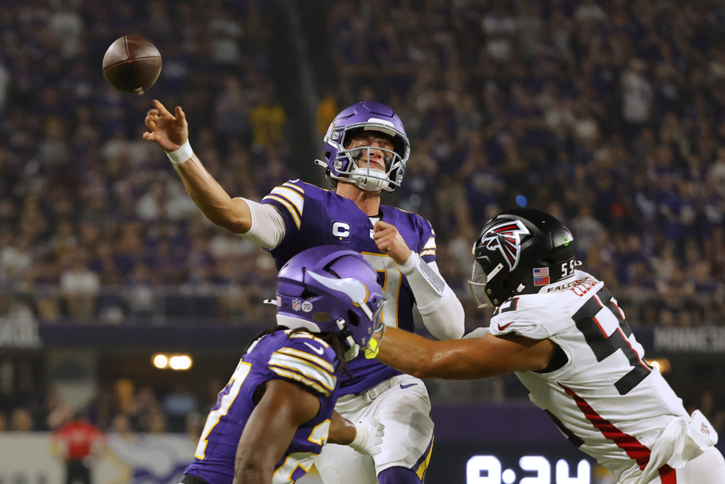 Minnesota Vikings quarterback J.J. McCarthy (9) passes the ball during the first half of an NFL football game against the Atlanta Falcons, Sunday, Sept. 14, 2025, in Minneapolis. (AP Photo/Bruce Kluckhohn)