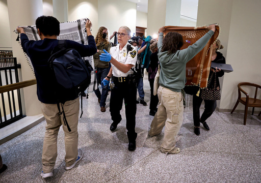 A court officer clears the area outside of a courtroom, Wednesday, Oct. 8, 2025, at Boston Municipal Court, where arraignments were held for protesters arrest at a pro-Palestinian rally in Boston on Tuesday night. (Mark Stockwell/The Boston Herald via AP, Pool) A court officer clears the area outside of a courtroom, Wednesday, Oct. 8, 2025, at Boston Municipal Court, where arraignments were held for protesters arrest at a pro-Palestinian rally in Boston on Tuesday night. (Mark Stockwell/The Boston Herald via AP, Pool)