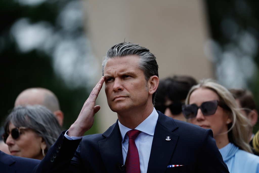 U.S. Defense Secretary Pete Hegseth salutes during a ceremony at the US cemetery to commemorate the 82nd anniversary of the D-Day, in Colleville-sur-Mer, Normandy, France, Saturday, June 6, 2026. (AP Photo/Jeremias Gonzalez)