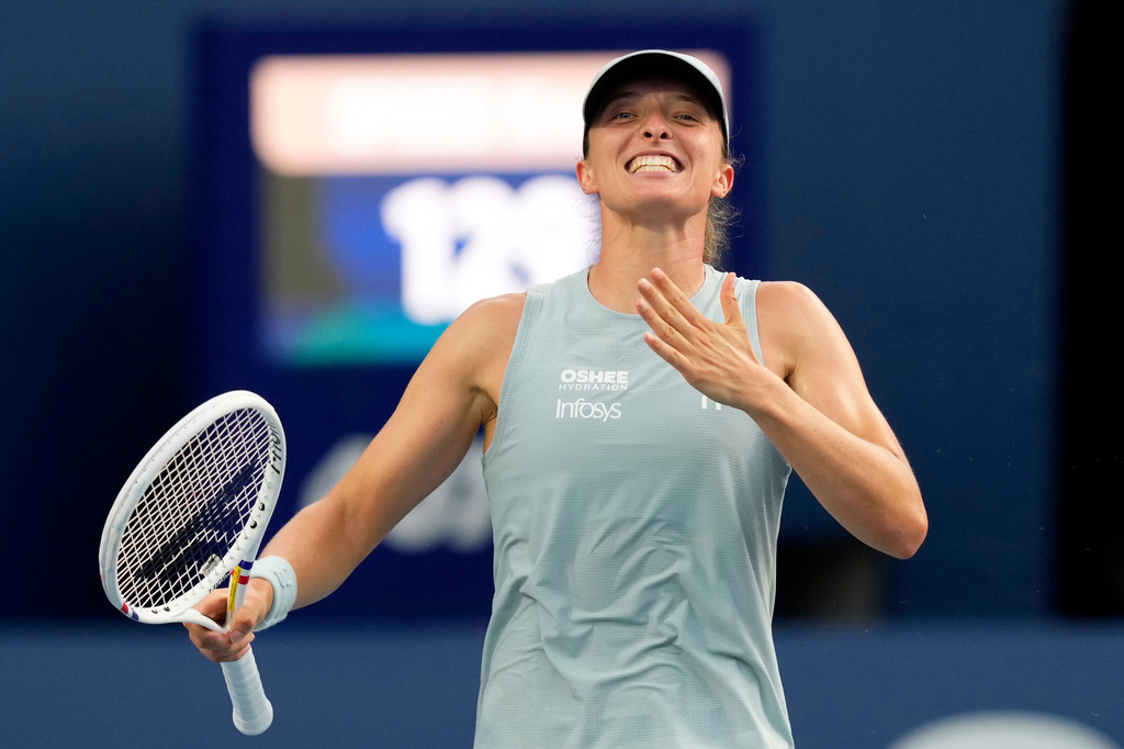 Poland's Iga Swiatek celebrates after defeating Kazakhstan's Elena Rybakina in a National Bank Open final tennis match, in Toronto, Thursday, Aug. 13, 2026. (Chris Young/The Canadian Press via AP)