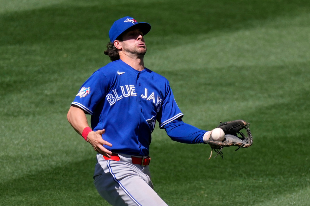 Toronto Blue Jays second baseman Ernie Clement misplays a ball hit by Los Angeles Angels' Vaughn Grissom during the seventh inning of a baseball game Wednesday, April 22, 2026, in Anaheim, Calif. (AP Photo/Mark J. Terrill)