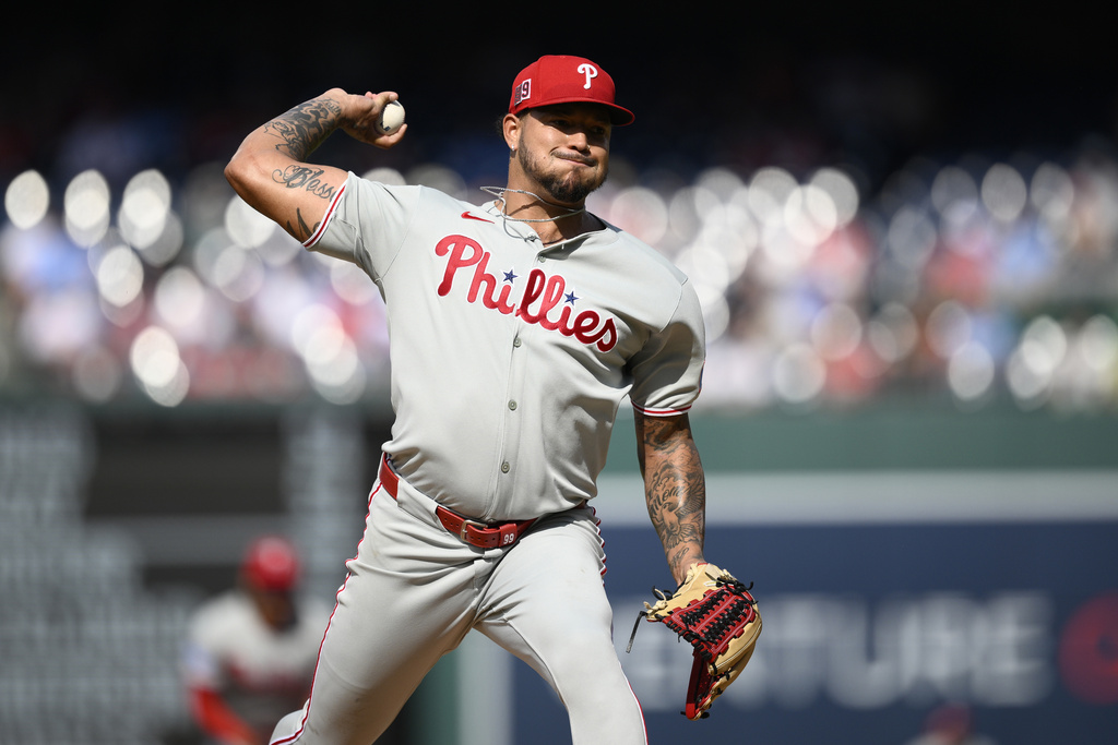 Philadelphia Phillies starting pitcher Taijuan Walker (99) throws during the first inning of a baseball game against the Washington Nationals, Saturday, Aug. 16, 2025, in Washington. (AP Photo/Nick Wass)
