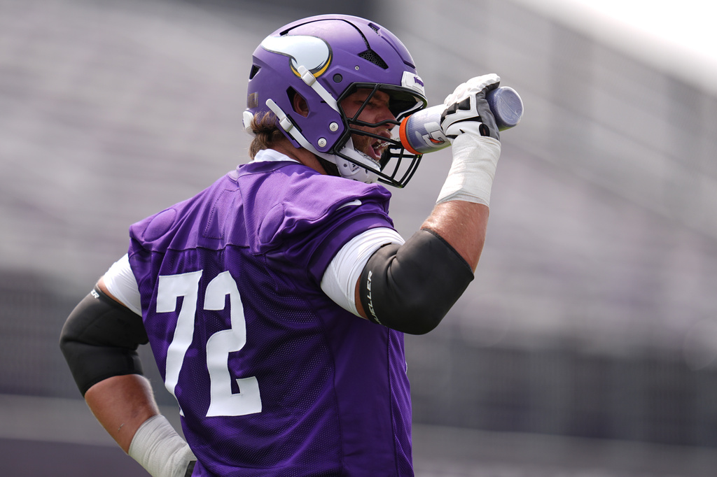 Minnesota Vikings tackle Ryan Van Demark (72) hydrates during the team's NFL football training camp Wednesday, July 29, 2026, in Eagan, Minn. (AP Photo/Abbie Parr)