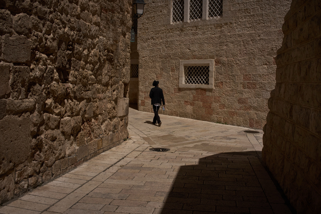 An ultra-Orthodox Jewish man walks in an alley near the site where a nun was attacked by a man last Wednesday, outside the Old City of Jerusalem, Friday, May 1, 2026.(AP Photo/Leo Correa)