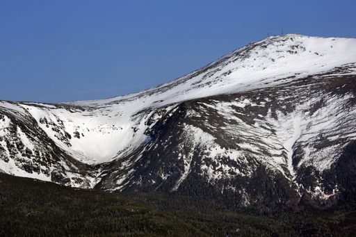 FILE - Tuckerman Ravine is seen at left, about one mile below the summit of 6,288-foot Mount Washington, in New Hampshire, Monday, May 4, 2015. (AP Photo/Robert F. Bukaty, File)