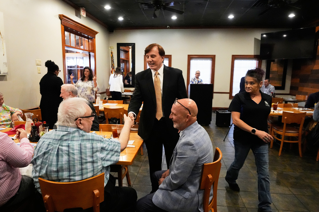 FILE - John Fleming, a U.S. Senate candidate, current Louisiana treasurer and former Republican House representative of Louisiana, greets supporters at a Ronald Reagan Newsmaker Luncheon in Baton Rouge, La., May 12, 2026. (AP Photo/Gerald Herbert, File)
