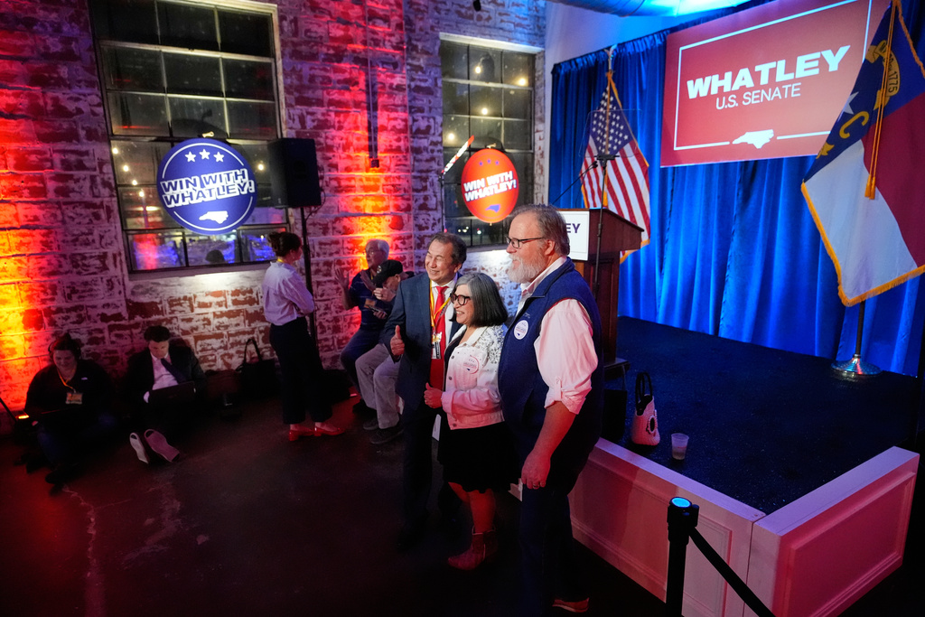From left, Viet Tran, Lorena Castillo-Ritz and John Steward pose for a photo together at the primary election night watch party for former RNC Chairman Michael Whatley, a Republican candidate for the U.S. Senate, Tuesday, March 3, 2026, in Charlotte, N.C. (AP Photo/Erik Verduzco)