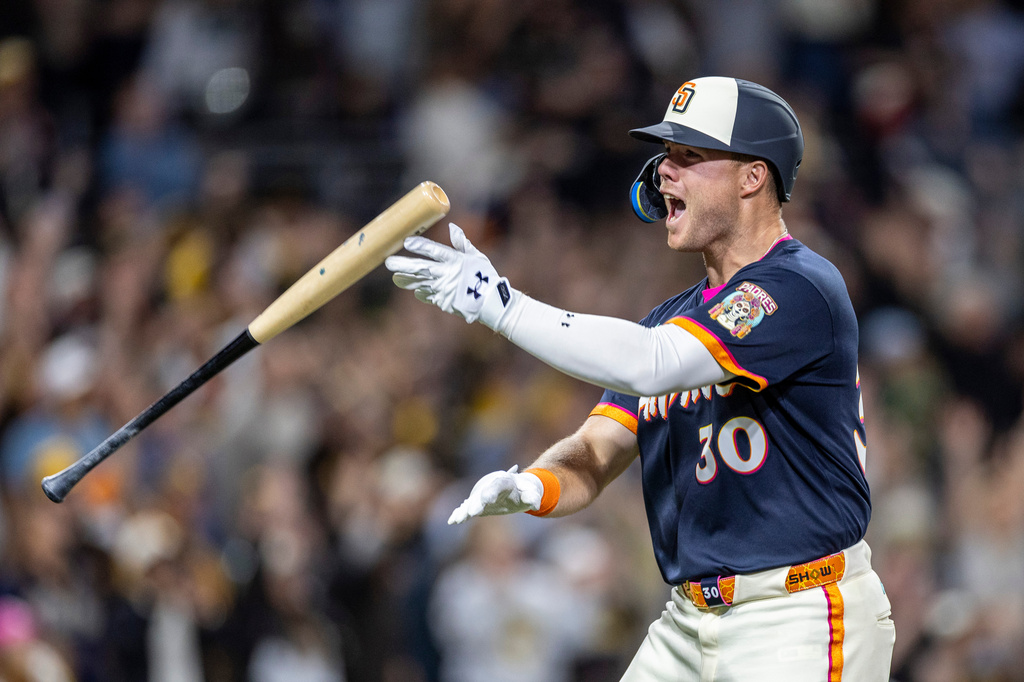 San Diego Padres' Gavin Sheets celebrates hitting a home run in the ninth inning of a baseball game against the Colorado Rockies, Friday, April 10, 2026, in San Diego. (AP Photo/Tony Ding)