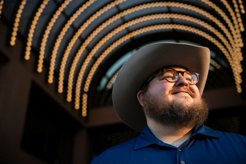 Giles Sims, who is getting a 90-hour bachelor of applied science in communication from Ensign College poses for a portrait on campus in Salt Lake City, Utah Thursday, Aug. 6, 2026, in Salt Lake City. (AP Photo/Marielle Scott)