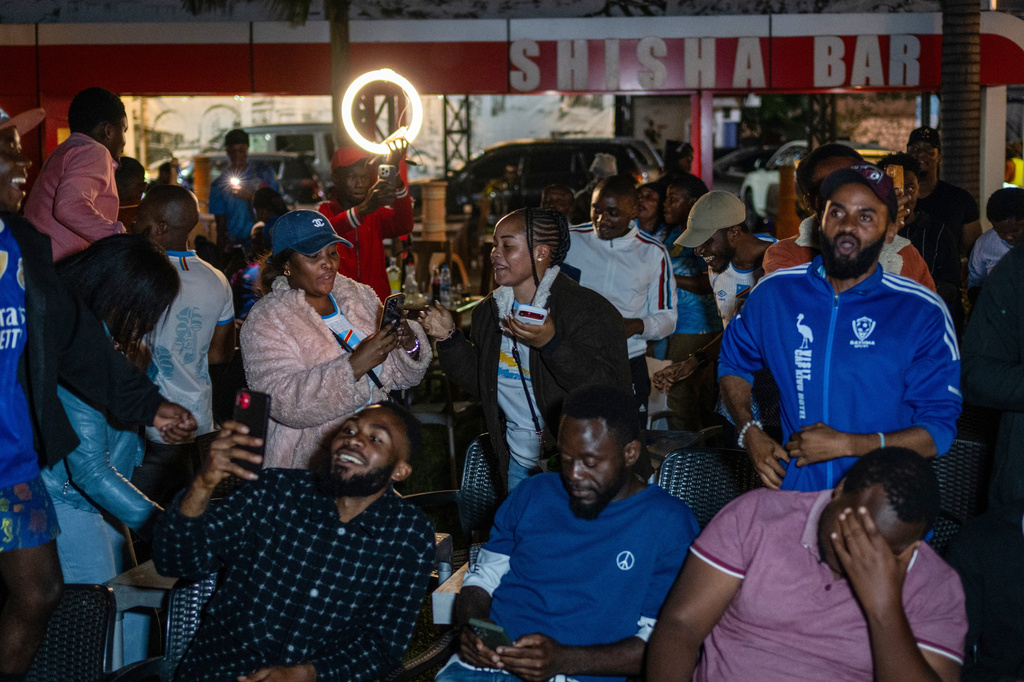 Congolese football fans celebrate in Goma, Democratic Republic of the Congo, as their team qualified for World Cup by winning over Jamaica in an intercontinental playoff, Wednesday, April 1, 2026.(AP Photo/Moses Sawasawa)