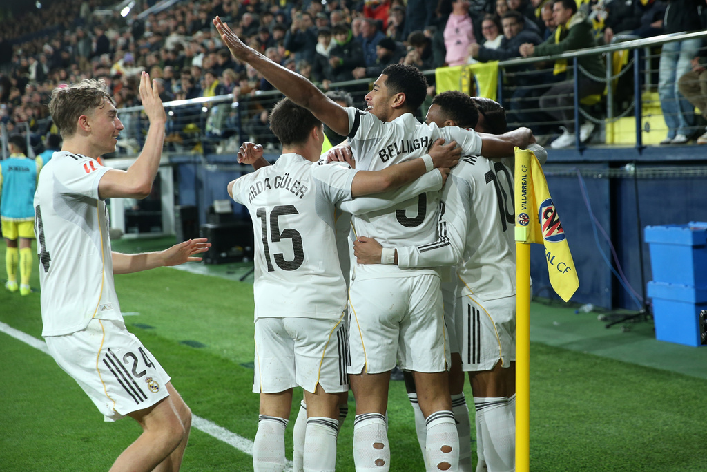 Real Madrid players celebrate after Kylian Mbappe scored the opening goal during a Spanish La Liga soccer match between Villarreal and Real Madrid in Villarreal, Spain, Saturday, Jan. 24, 2026. (AP Photo/Alberto Saiz)